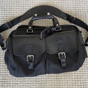 Tumi Leather and Canvas Laptop bag with multiple zippered pockets, etc.
